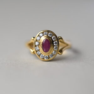 Contemporary 18ct gold ruby and channel set diamond cluster ring
