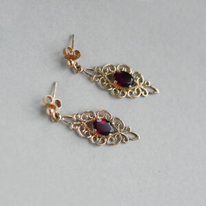 Aesthetic pair of 9ct gold openwork garnet drop earrings