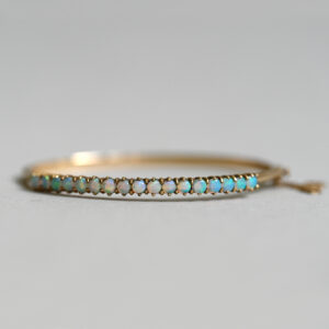 Contemporary 9ct gold opal line bangle bracelet