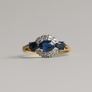 Classic 18ct gold three stone sapphire and diamond cluster ring