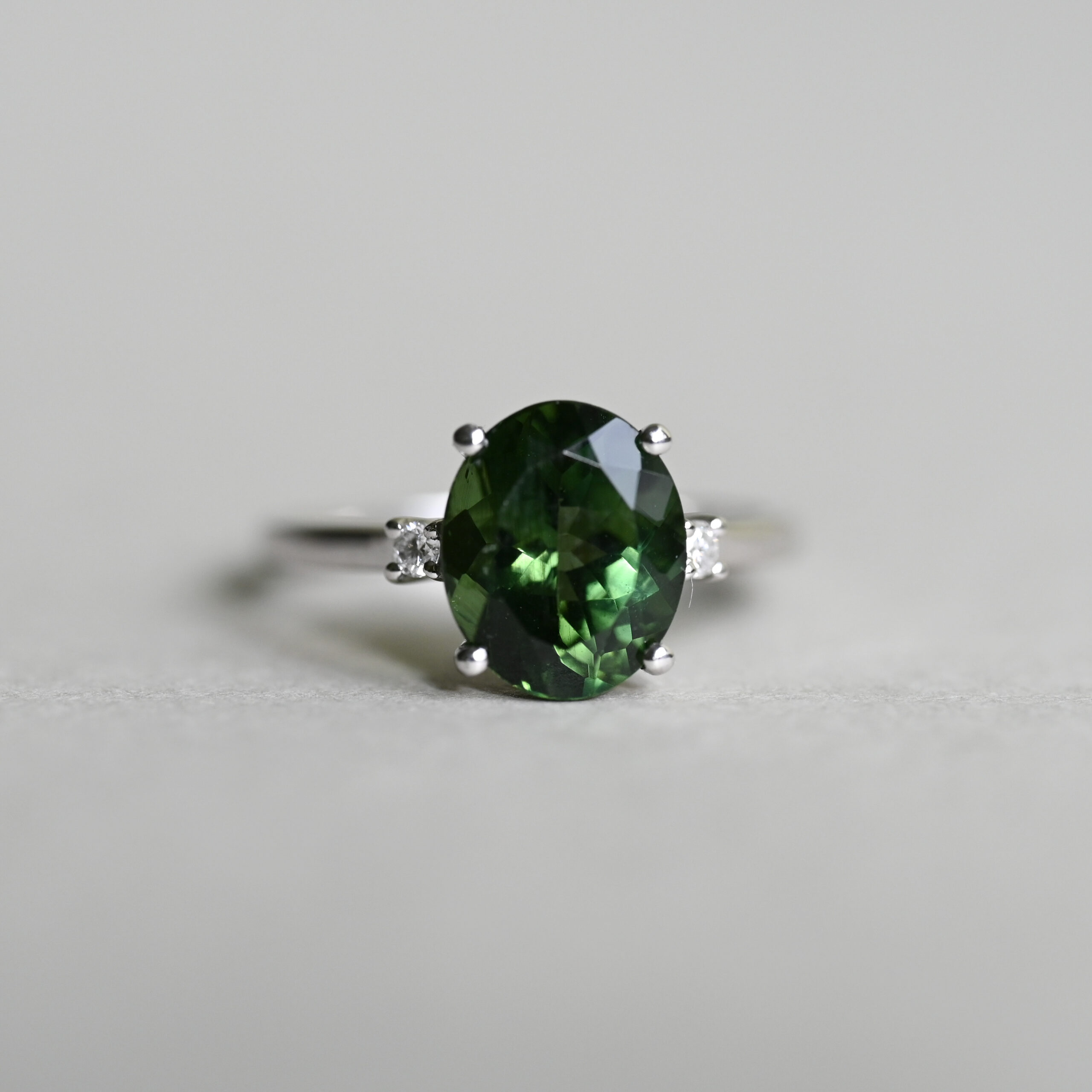 Classic 14ct white gold green tourmaline and mini diamond ring