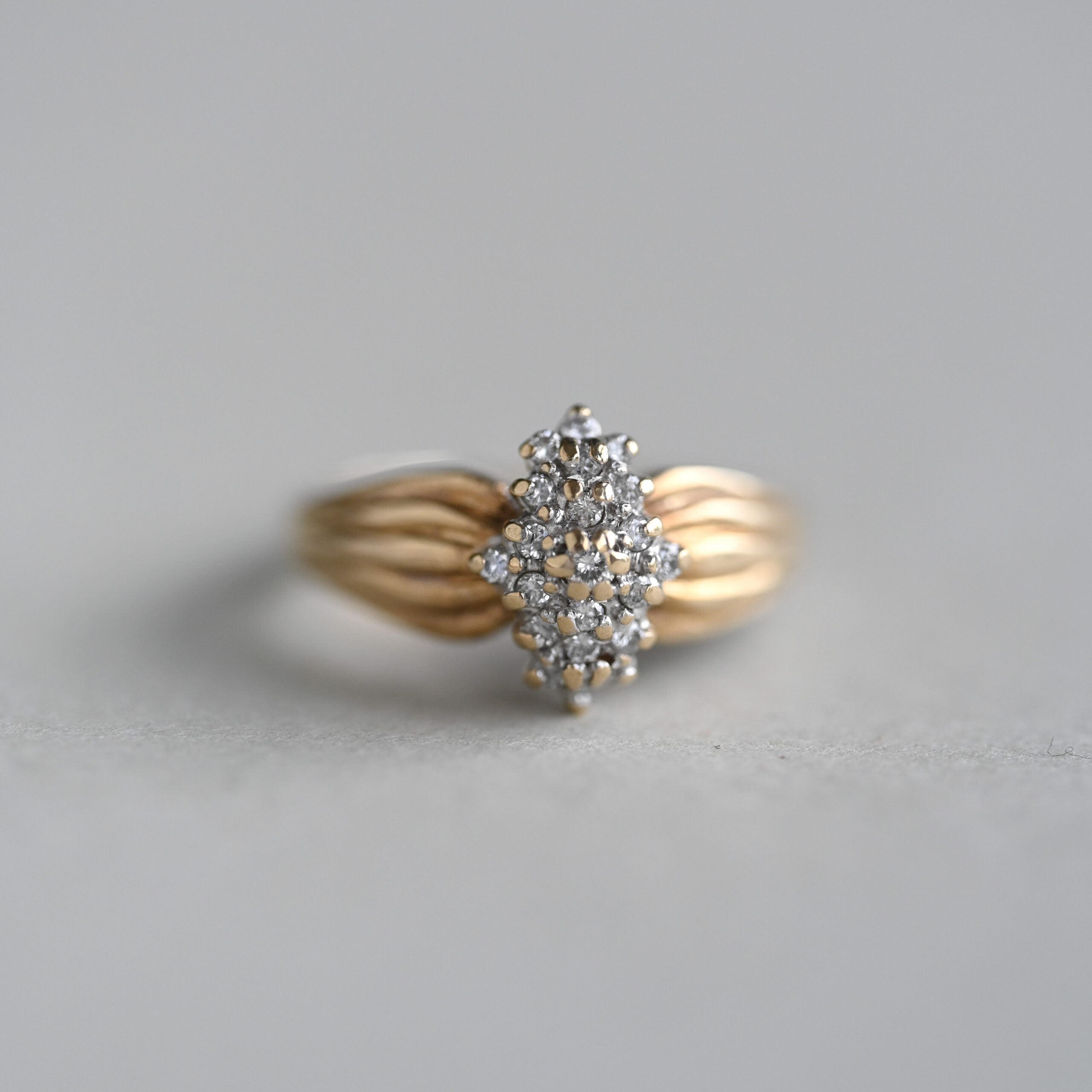 Contemporary 9ct gold mini diamond ring with grooved shoulders